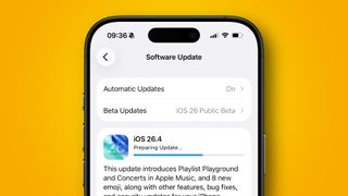 An iPhone 16 Pro updating to the iOS 26.4 beta.