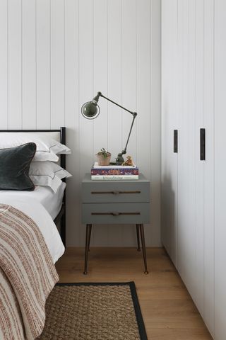 rustic bedroom with white wood panelling