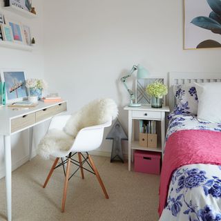 white bedroom with desk, chair and bedside table