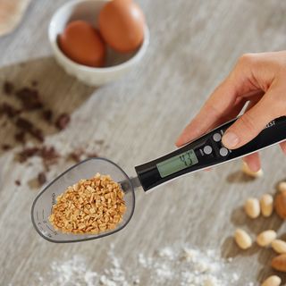 digital measuring spoon and eggs