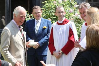 Prince Charles, Prince of Wales speaks to guests as he attends a service for the Centenary of the Church in Wales