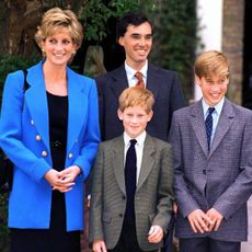 Princess Diana wears a blue jacket with a black dress while attending Eton College with Prince Harry, Prince William, and King Charles