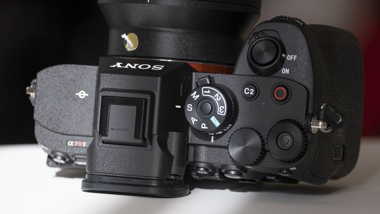 The Sony A7R V camera sitting on a white table
