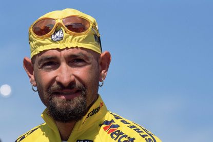 Marco Pantani in a yellow jersey and cycling cap
