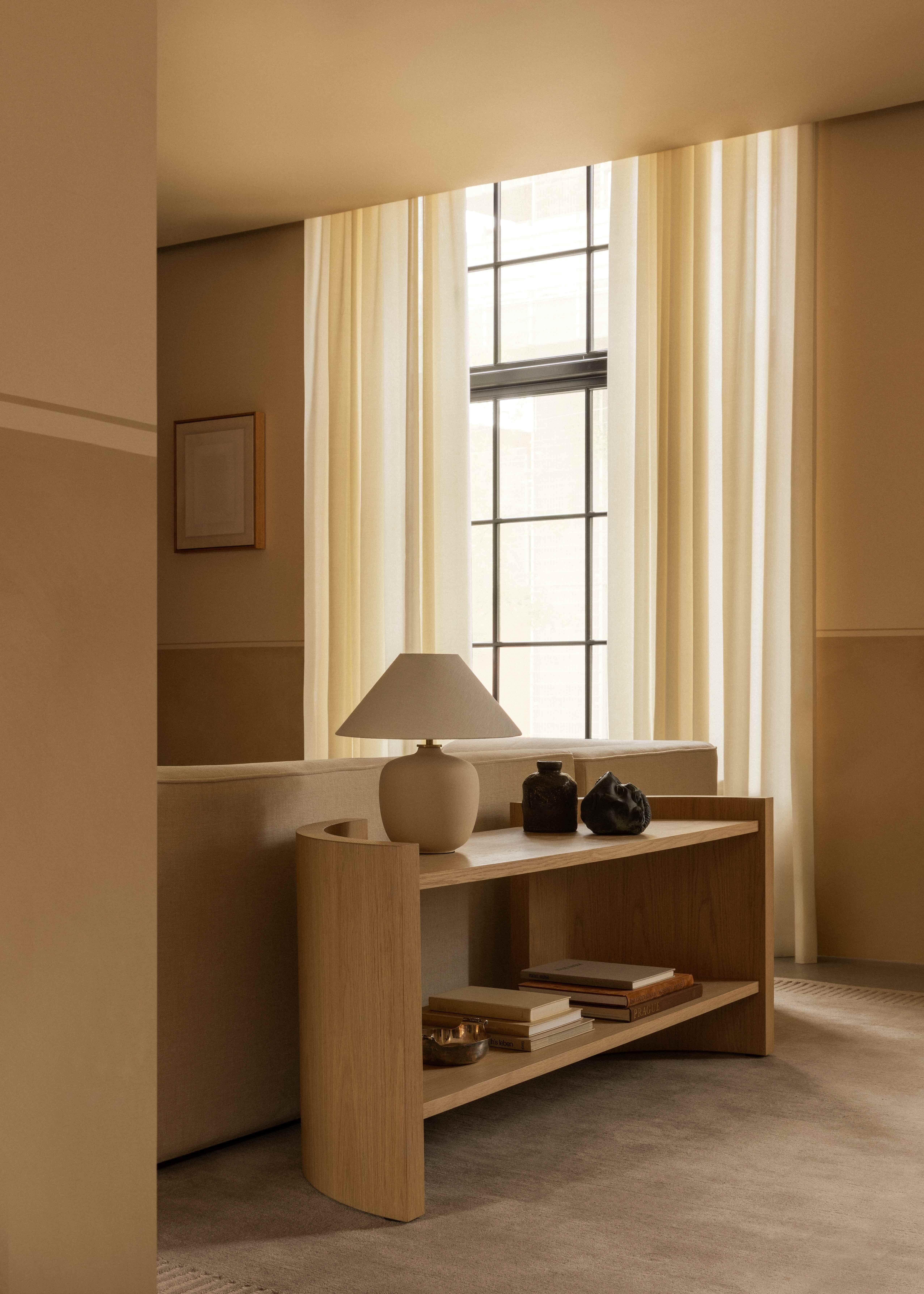 freestanding shelving unit in oak in a neutral interior