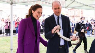 Kate Middleton, Prince William holding a snake