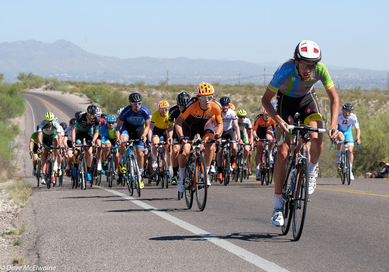 The Pro Men respond to a breakaway during the third lap
