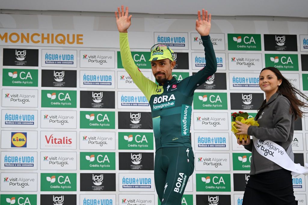 ALTODAFOIA PORTUGAL FEBRUARY 15 Daniel Felipe Martinez of Colombia and Team BORA hansgrohe celebrates at podium as Yellow leader jersey winner during the 50th Volta ao Algarve em Bicicleta 2024 Stage 2 a 1719km stage from Lagoa to Alto da Foia 888m on February 15 2024 in Alto da Foia Portugal Photo by Dario BelingheriGetty Images
