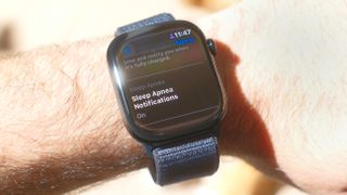 Close-up of an Apple Watch 10 on a user's wrist with the screen showing that the sleep apnea safety feature is switched on