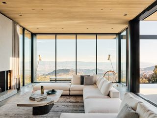 Living room and desert views at High Desert Retreat by Aidlin Darling Design