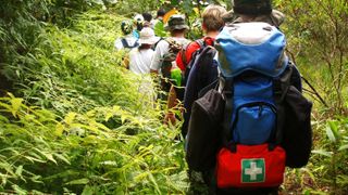 hiking whistles: hiking carrying first aid kit