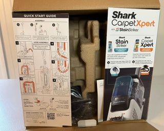 Shark CarpetXpert with Stainstriker Carpet Cleaner instructions printed on cardboard box