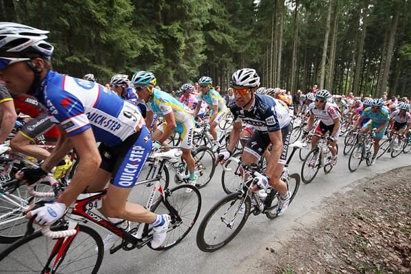 Saxo Bank's Jens Voigt rides next to eventual winner Alexandre Vinokourov.