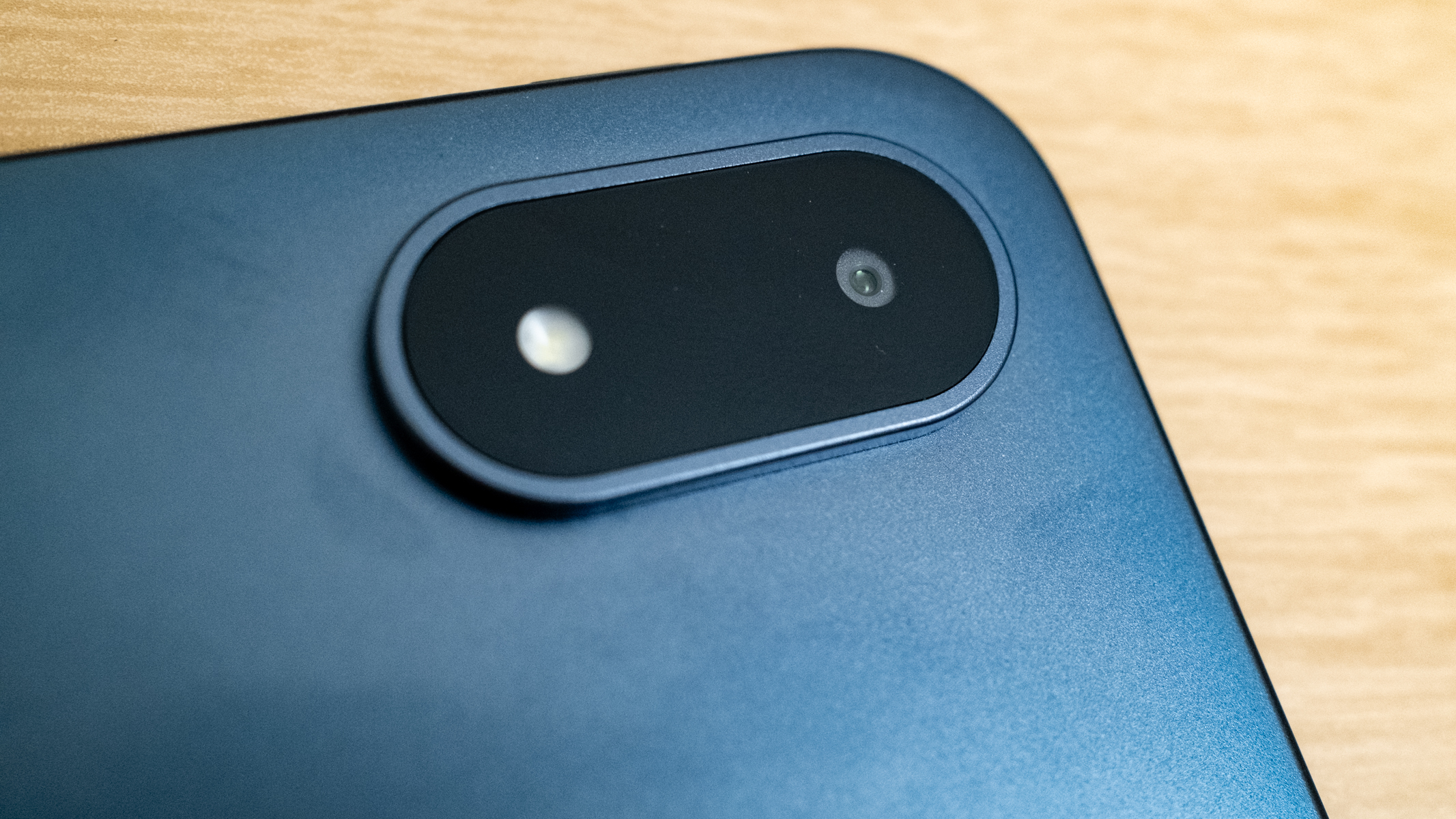 OnePlus Pad 3 camera detail on a wooden table