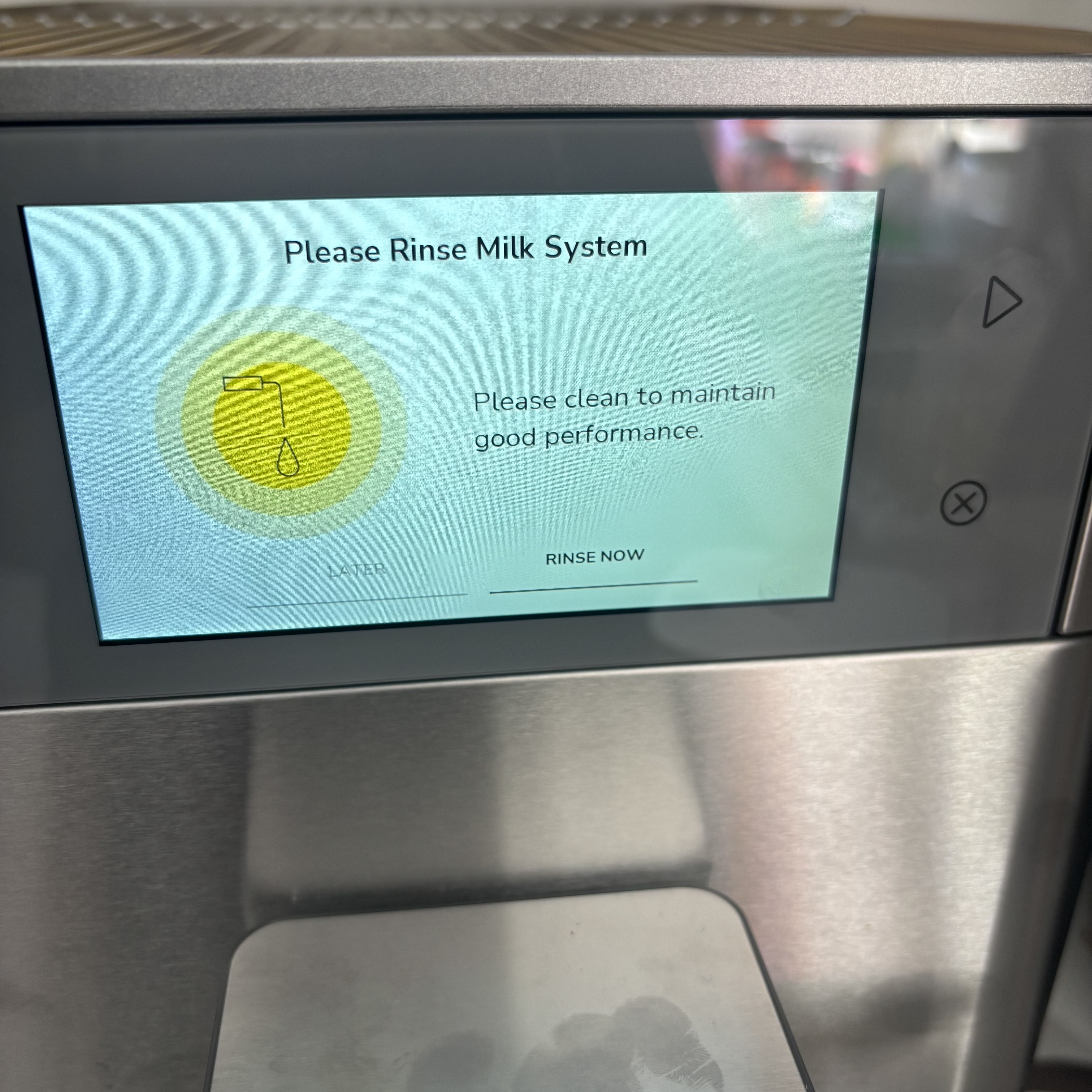 A reminder from the KitchenAid Fully Automatic Espresso Machine KF8 to rinse the milk system.