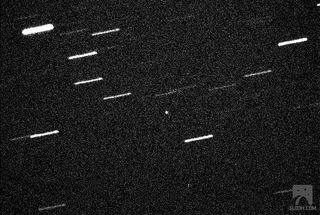 The 460-foot (140-meter) asteroid 2013 ET is seen through a Slooh Space Camera telescope in the Canary Islands on March 9, 2013, during its close approach to Earth. The asteroid was just within 600,000 miles of Earth, about 2.5 times the Earth-moon distance.