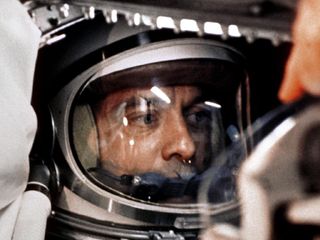 Astronaut Alan B. Shepard, Jr. sits in his Freedom 7 Mercury capsule, ready for launch. Just 23 days earlier, Soviet cosmonaut Yuri Gagarin had become the first man in space. After several delays and more than four hours in the capsule, Shepard was ready to go, and he famously urged mission controllers to ''fix your little problem and light this candle."