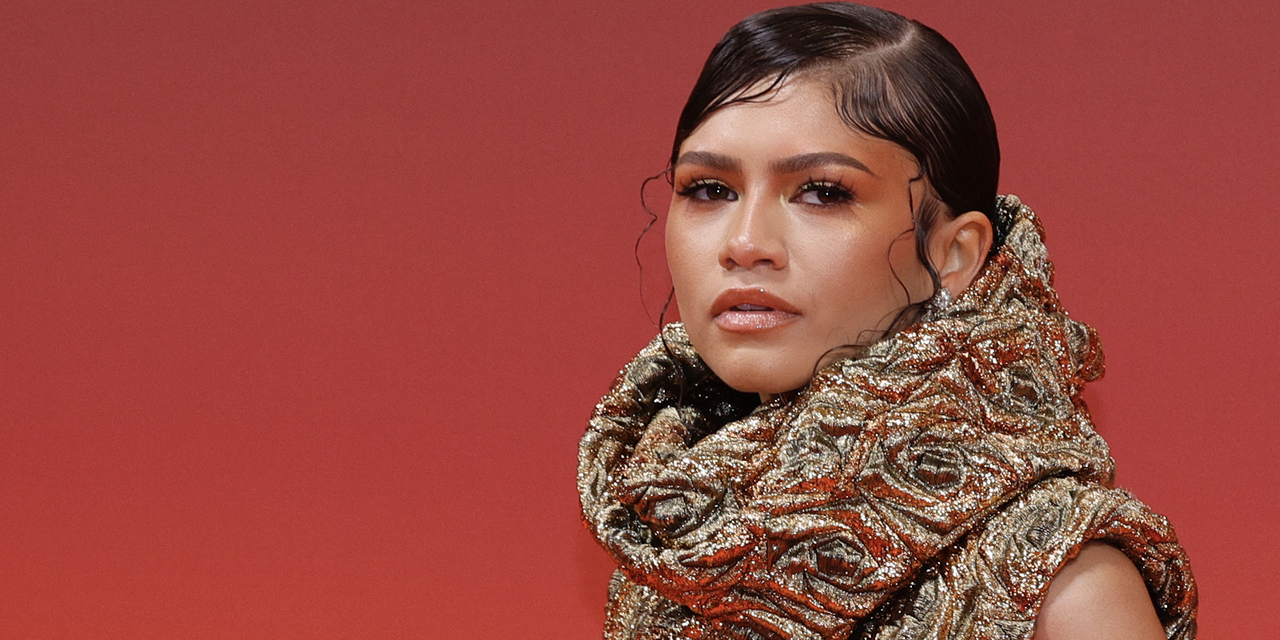 zendaya wears a gold cowl neck on the red carpet at dune 2 premiere