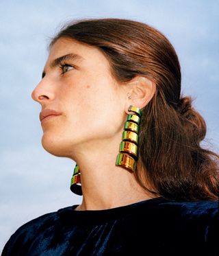 spiral earrings on woman