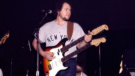 American Pop Rock musician Christopher Cross plays electric guitar as he performs onstage at Greenwich Village's Bottom Line, New York, New York, May 28, 1980. His instrument is a Fender twin-neck, six & twelve string guitar.