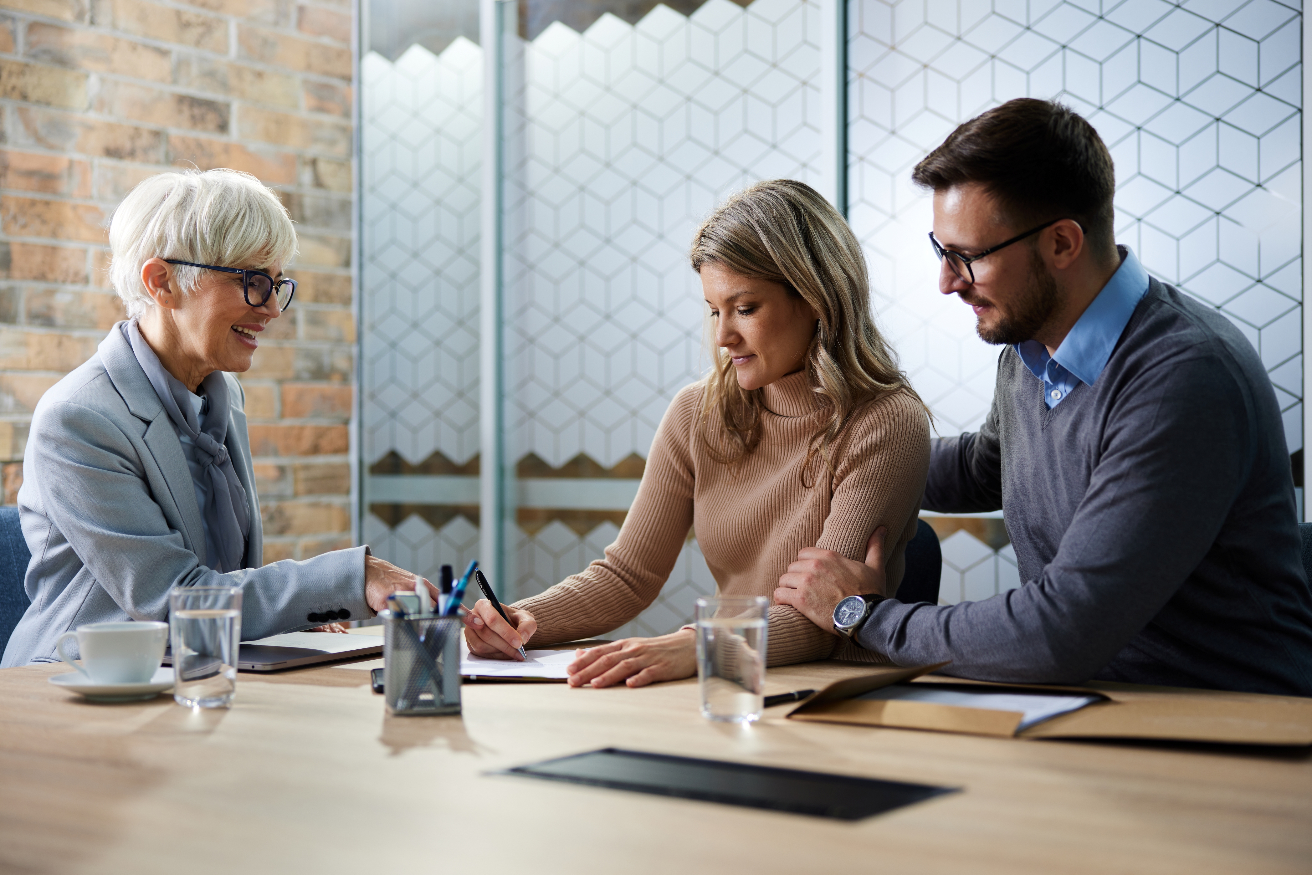 A financial adviser helps a couple manage their finances