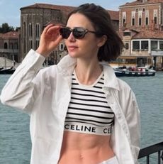 Lily Collins wears a striped bra top in Venice, Italy
