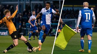 Bristol Rovers player is challenged for the ball, assistant referee flags to stop play as Bristol Rovers player walks away