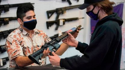 A customer looks at a customized AR-15.