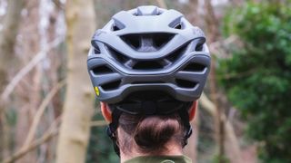 Back of a rider's head wearing the MET Estro MIPS helmet
