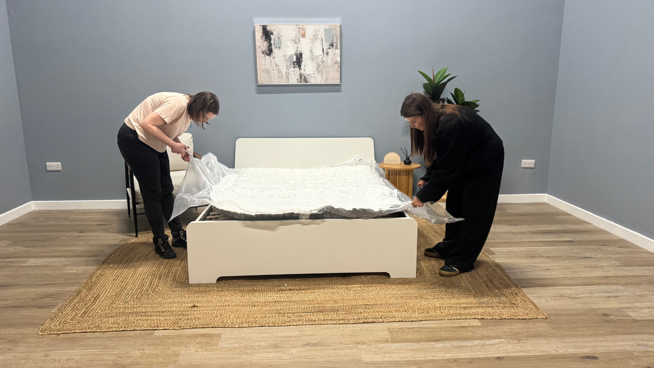 Unpacking the mattress on the bed