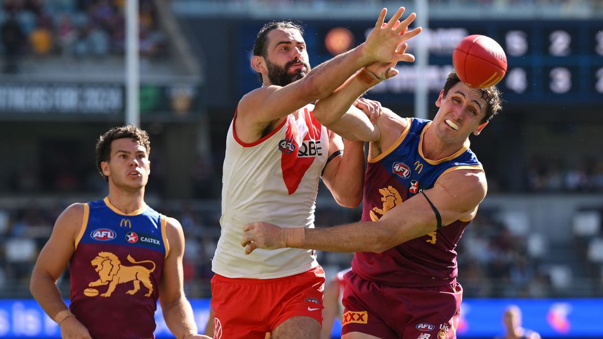 Oscar McInerney of the Lions competes for the ball against Brodie Grundy of the Swans during the round 19 AFL match between Brisbane Lions and Sydney Swans at The Gabba, on July 21, 2024, in Brisbane, Australia.