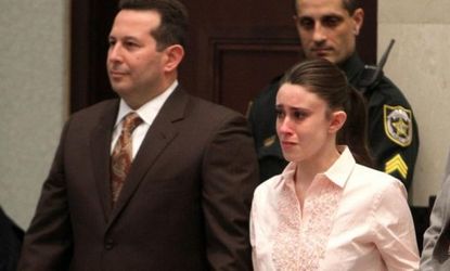 Casey Anthony reacts Tuesday to being found not guilty of murder: The high-profile trial and verdict has many Americans criticizing the justice system.