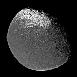 Walnut-Shaped Moon's Mystery Solved