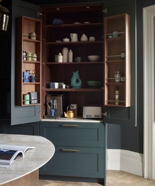 Blue kitchen pantry, wooden shelves