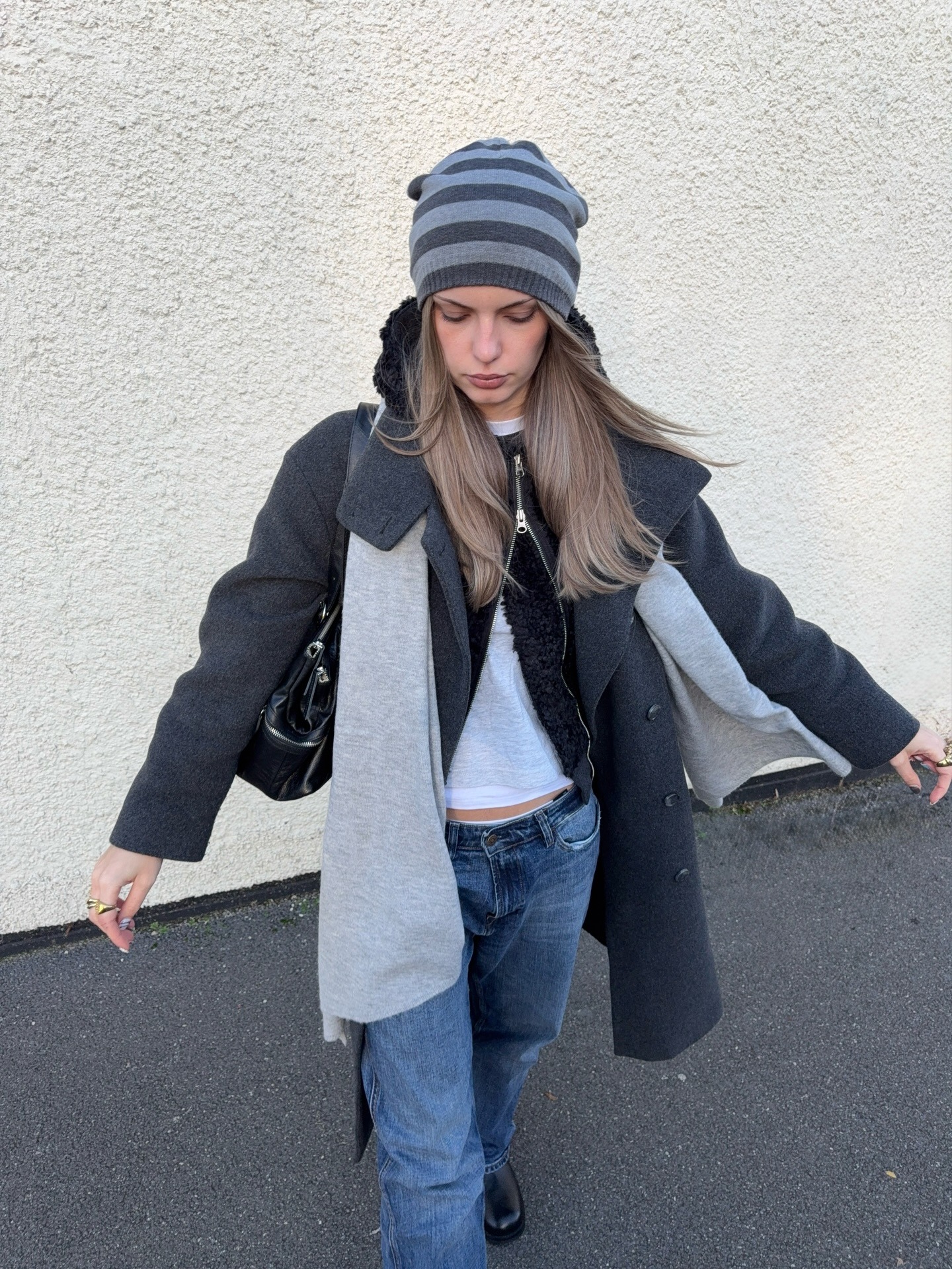 Fashion person Mia Dickerson wears the Zip up knitted jacket trend.