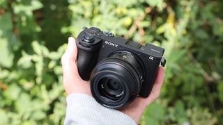 Sony a6700 digital camera held in a hand