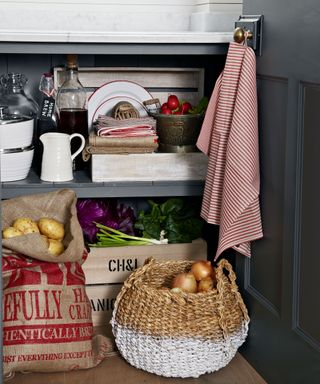 kitchen shelving with baskets of vegetables