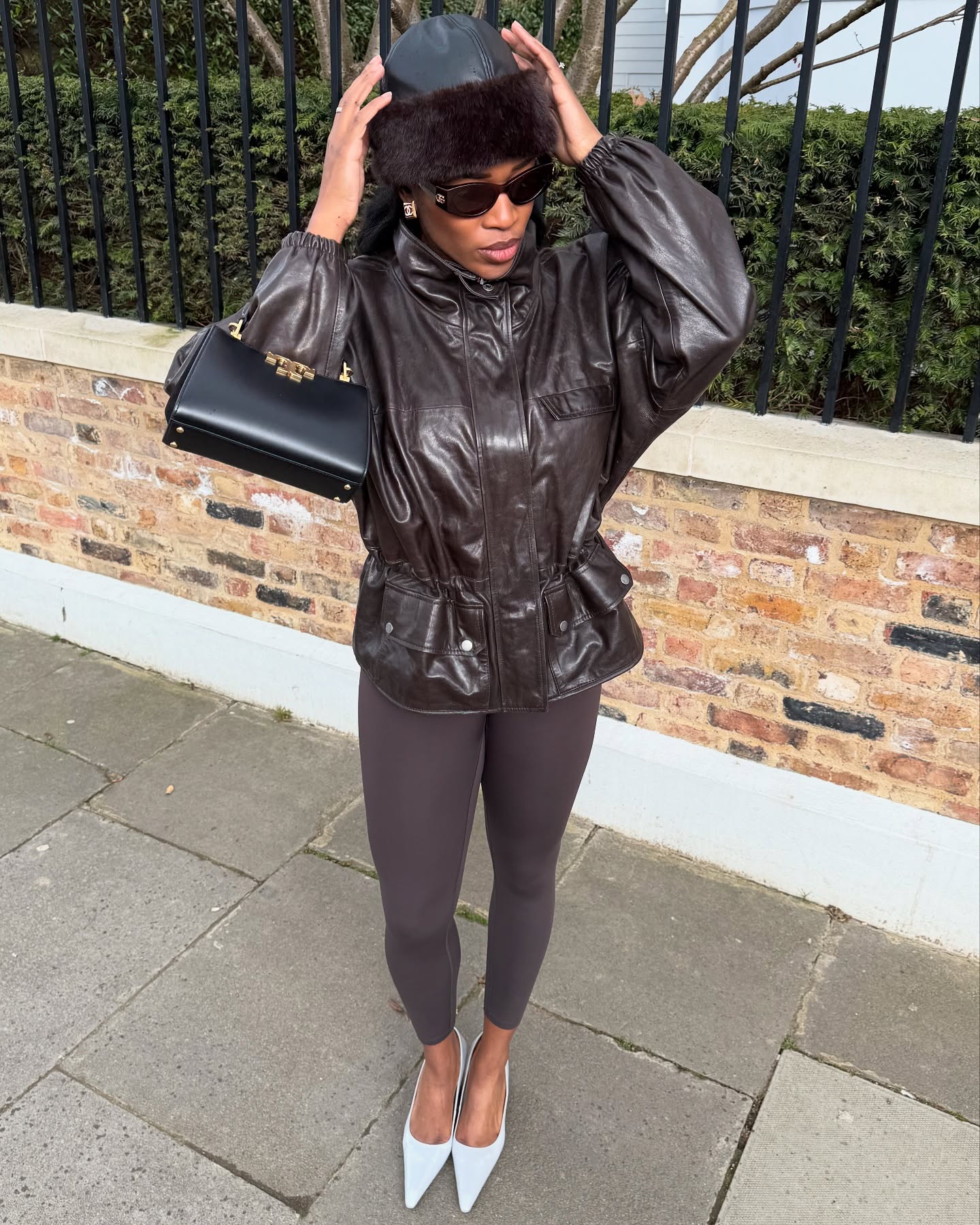 Girl posing for a picture wearing neutral, classic pieces