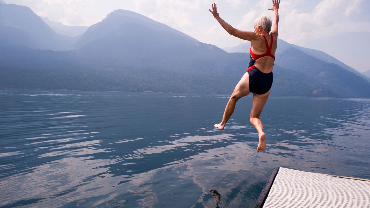 lady jumping into lake