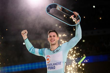 Harrie Lavreysen of the Netherlands celebrates with his trophy after winning the Men's Sprint overall title for inaugural Track Champions League
