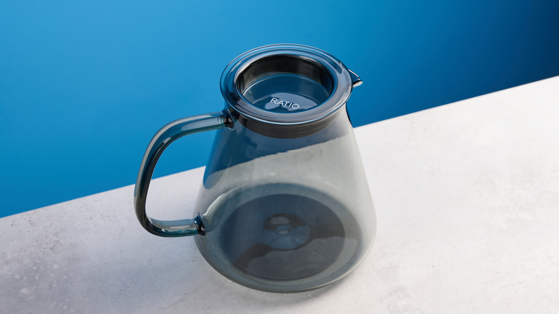 the ratio four coffee maker photographed against a blue tom's guide background