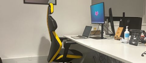 The Sybr Si1 Gaming Chair at a desk in an office.