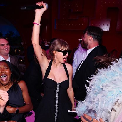 Taylor Swift at the Eras Tour wrap party Travis Kelce threw her in Kansas City. 