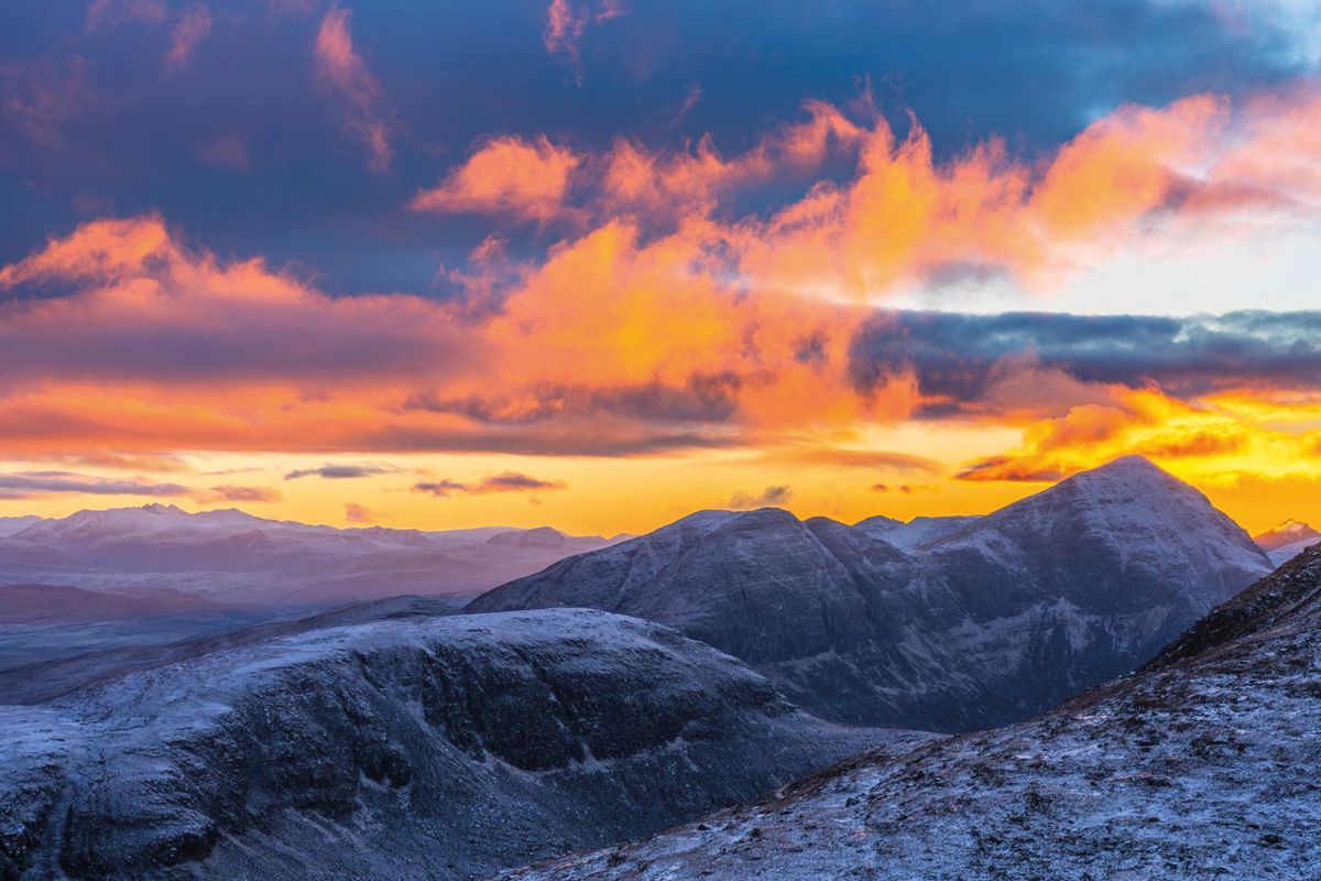 Mountain scene with backlit clouds