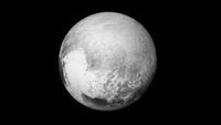 A black and white world with some white sections toward the borrom left in the shape of a heart.
