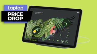 Google Pixel tablet with charging speaker dock against a green background