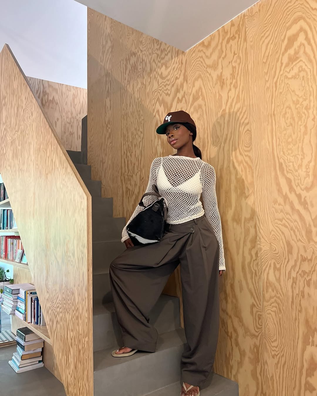 Aude-Julie in pleated trousers and mesh top