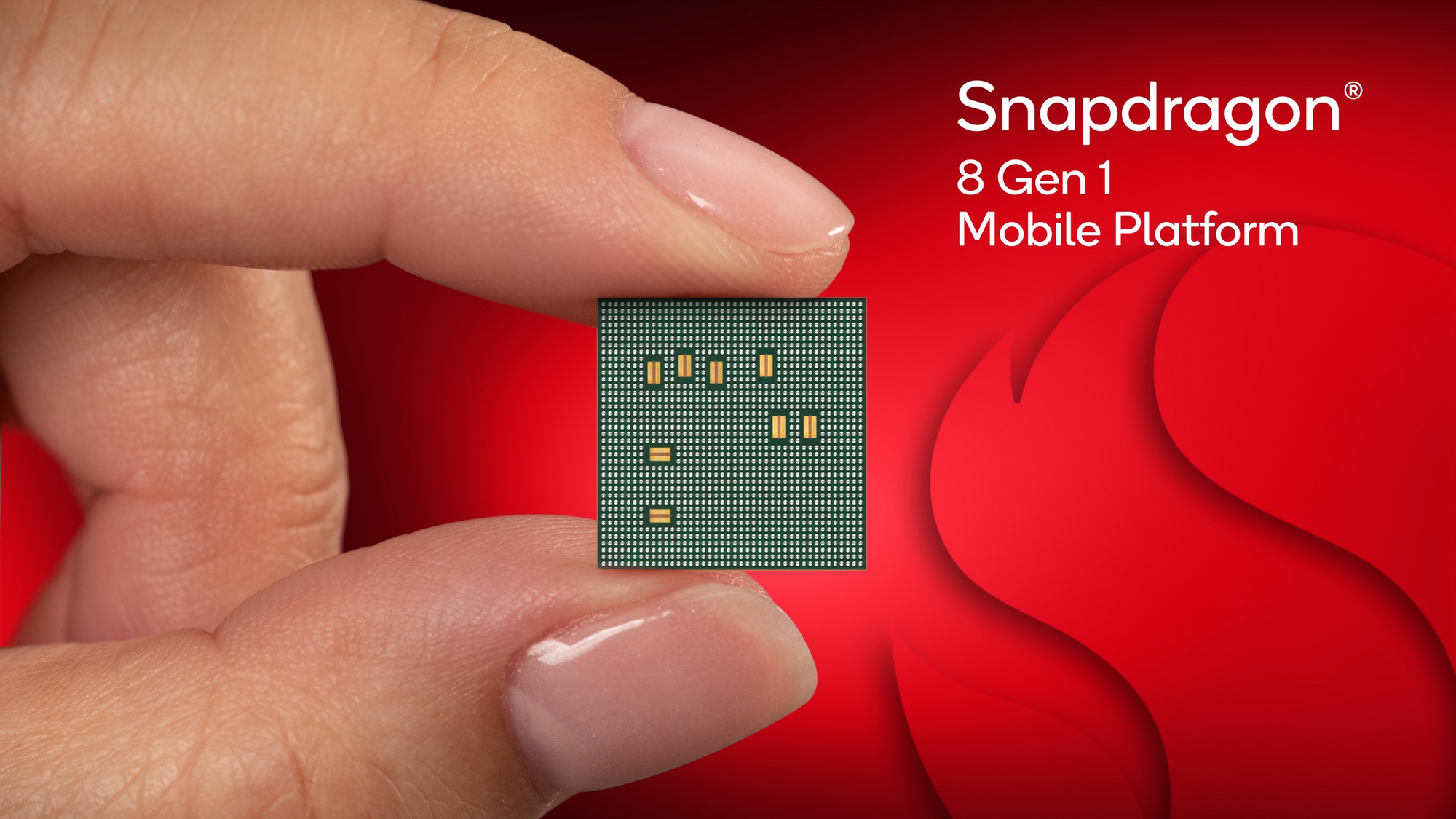 The Snapdragon 8 Gen 1 chip held between two fingers