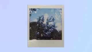 A multiple exposure shot of a person and trees, taken on a Lomography Lomo’Instant Square Glass camera