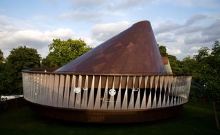 A timber-clad structure, reminiscent of a giant spinning top 